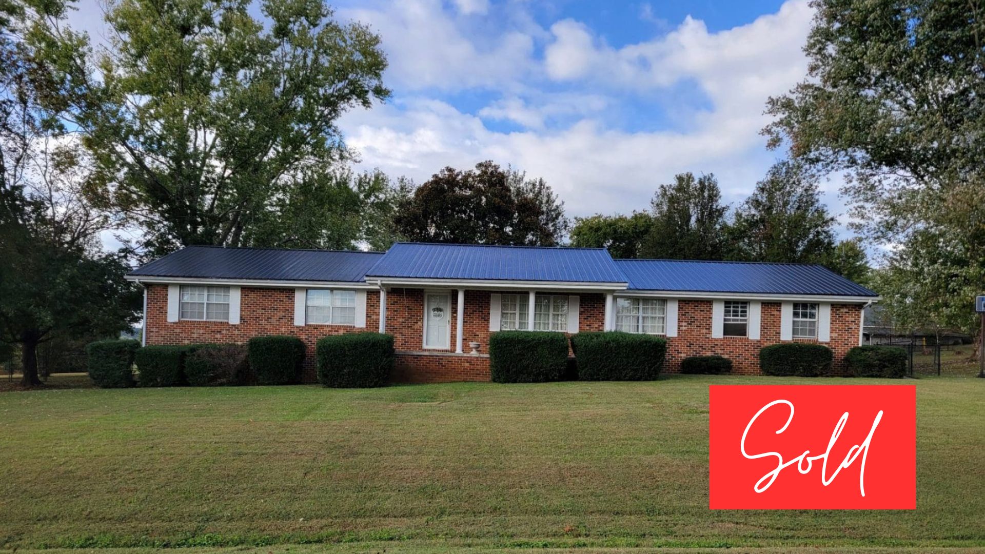 This image is by Powell Auction & Realty.